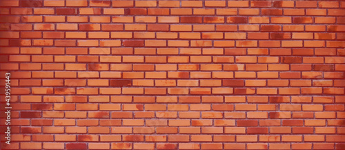 Red brick wall background, brown blocks of stonework