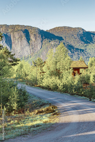 Morning sunrise with mountains cottages nature forest landscape Nissedal Norway. photo