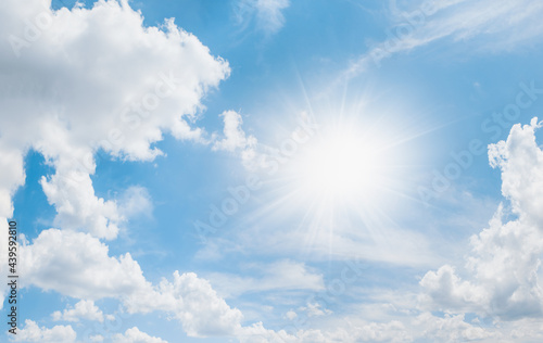 Blue Sky With Clouds And Sun Rays