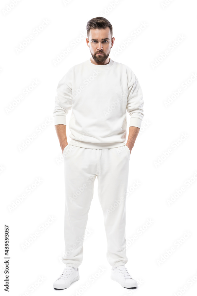 Handsome man wearing blank white clothes on white background Handsome man wearing blank white clothes on white background