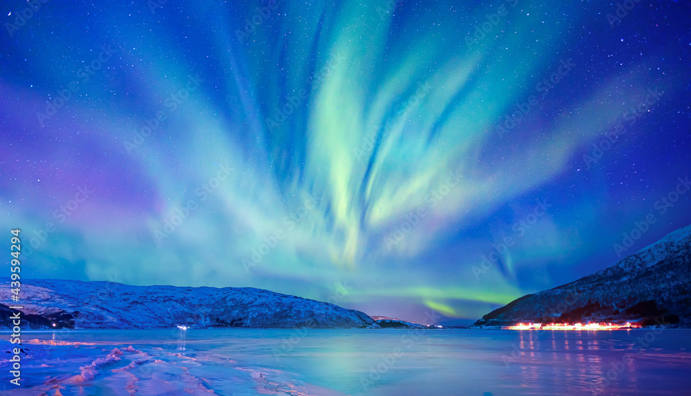 Northern lights or Aurora borealis in the sky over Tromso, Norway