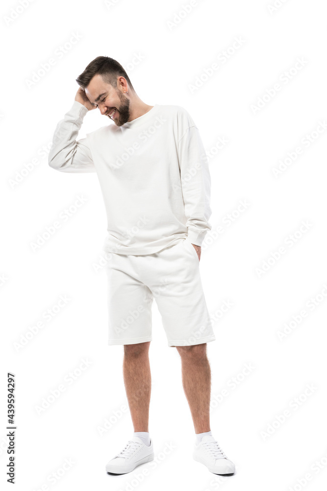Man wearing white long-sleeved t-shirt and shorts on white background Man wearing white long-sleeved t-shirt and shorts on white background