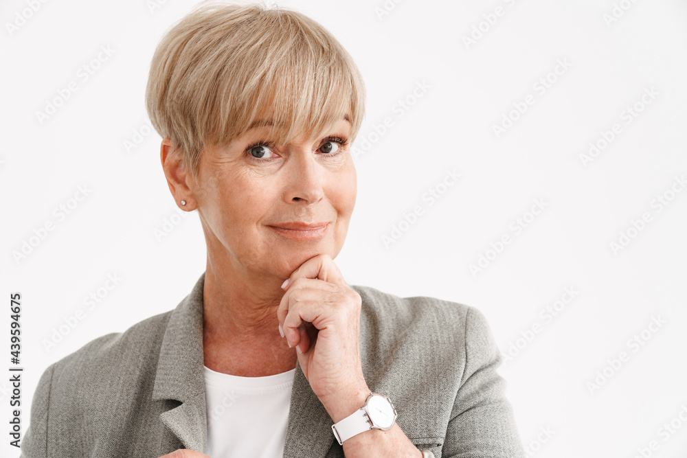 European mature woman smiling and looking at camera