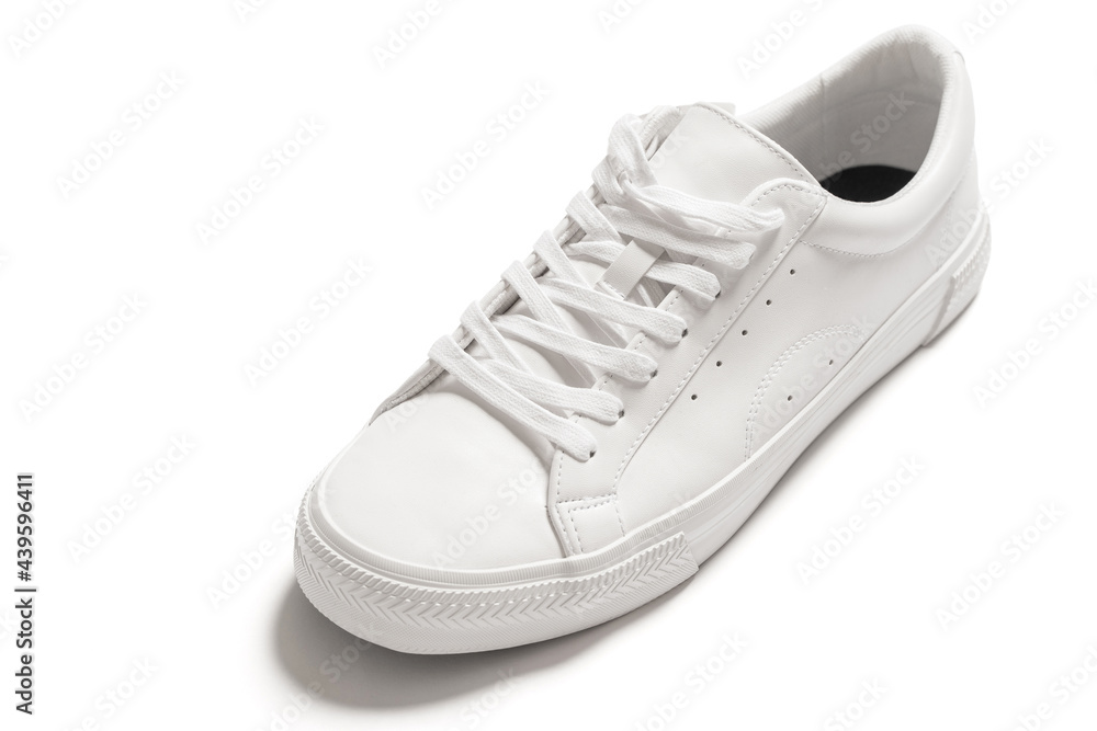White leather shoe with a casted shadow on white background White leather shoe with a casted shadow on white background