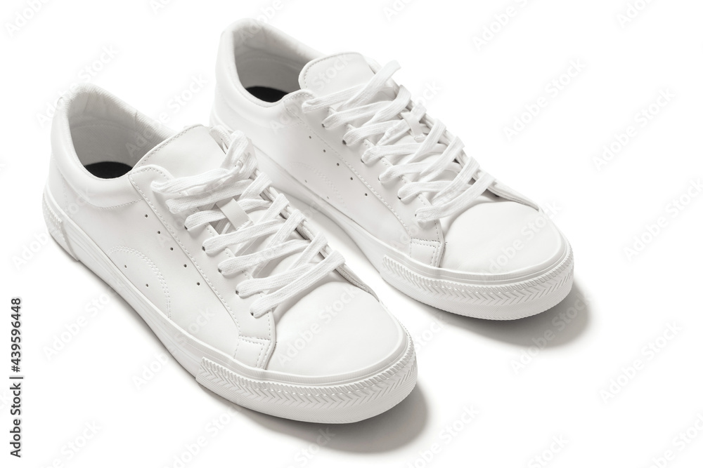 Pair of white leather trainers on white background