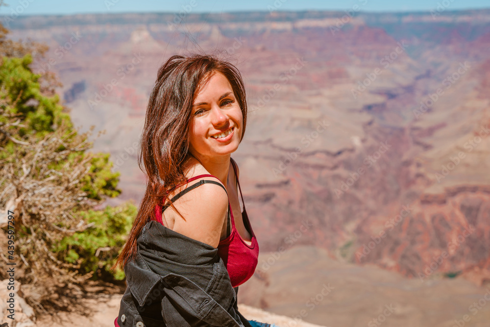 Female happy tourist at Grand Canyon, Arizona Female happy tourist at Grand Canyon, Arizona
