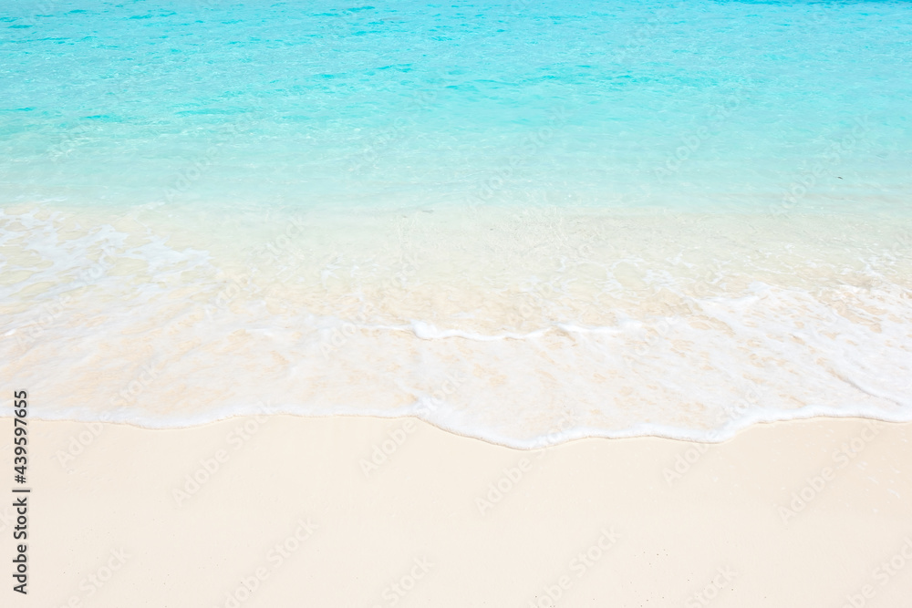 Clean fine sand beach, white foam and blue-green water in Maldives Clean fine sand beach, white foam and blue-green water in Maldives