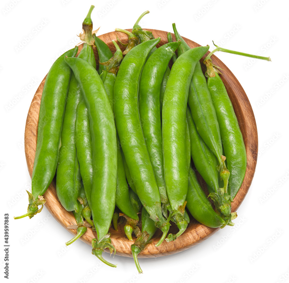 Fresh green pea pods in wooden bowl isolated on white background. clipping path Fresh green pea pods in wooden bowl isolated on white background. clipping path