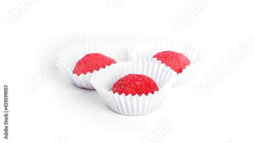 Red, chocolate candy truffles isolated on a white background. Raspberry candy.