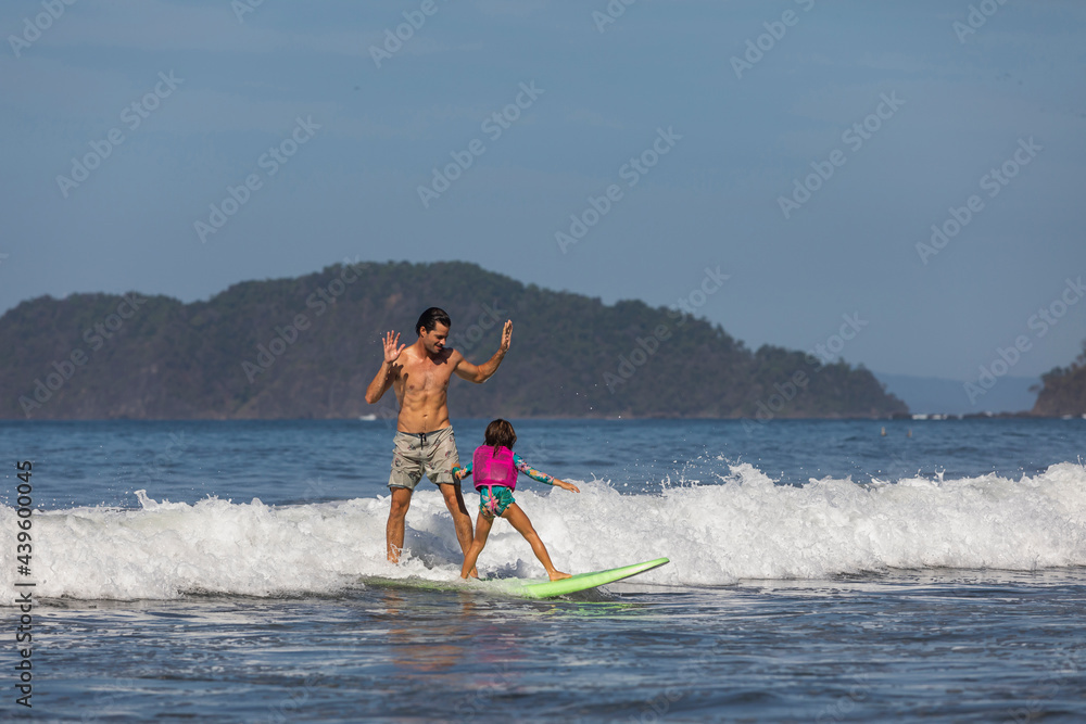 Family Surfing Together at Jaco Beach 