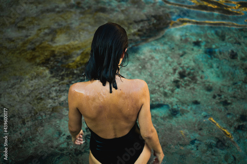 Back View Of Young Woman By The Sea