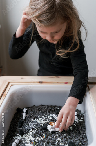 little kid outer space themed sensory bin   photo