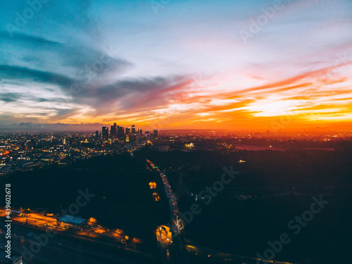 Evening  in modern cityscape with sunset in sky