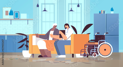 friendly nurse or volunteer supporting elderly woman home care services healthcare and social support