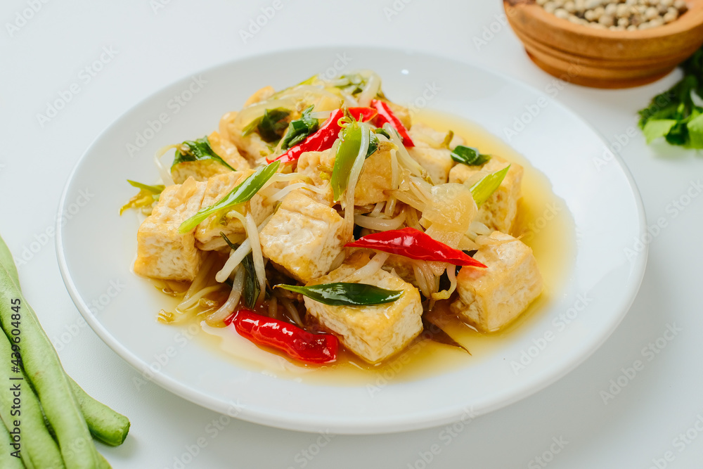 Indonesian stir fry bean sprouts mixed with fried tofu Indonesian stir fry bean sprouts mixed with fried tofu