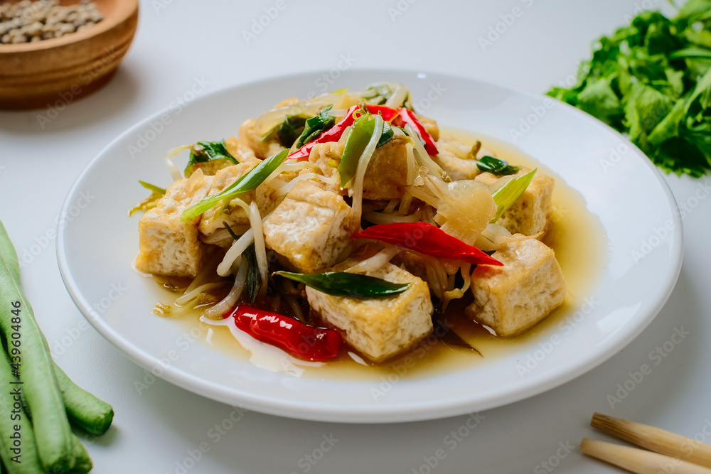 Indonesian stir fry bean sprouts mixed with fried tofu Indonesian stir fry bean sprouts mixed with fried tofu