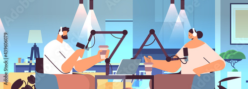 podcasters talking to microphones recording podcast in studio podcasting online radio broadcasting concept