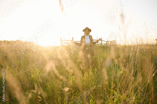 person in the field at sunset