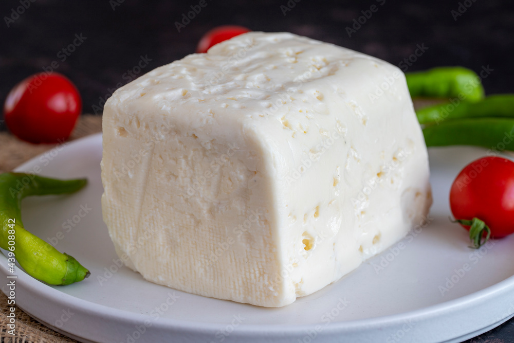 Feta cheese on dark background