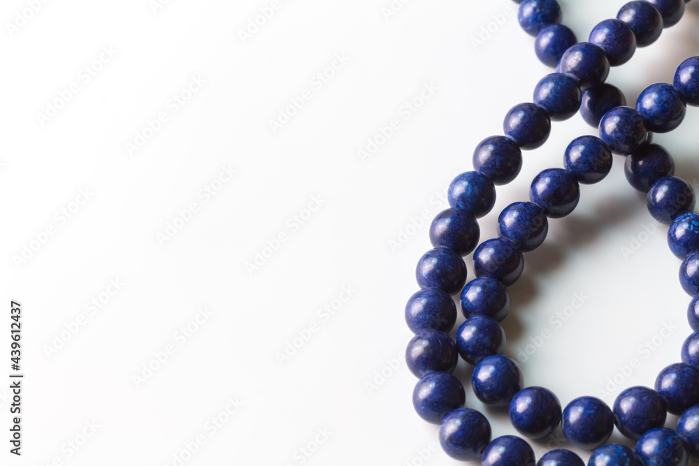 Lapis Lazuli bead necklace isolated on white with copy space Lapis Lazuli bead necklace isolated on white with copy space