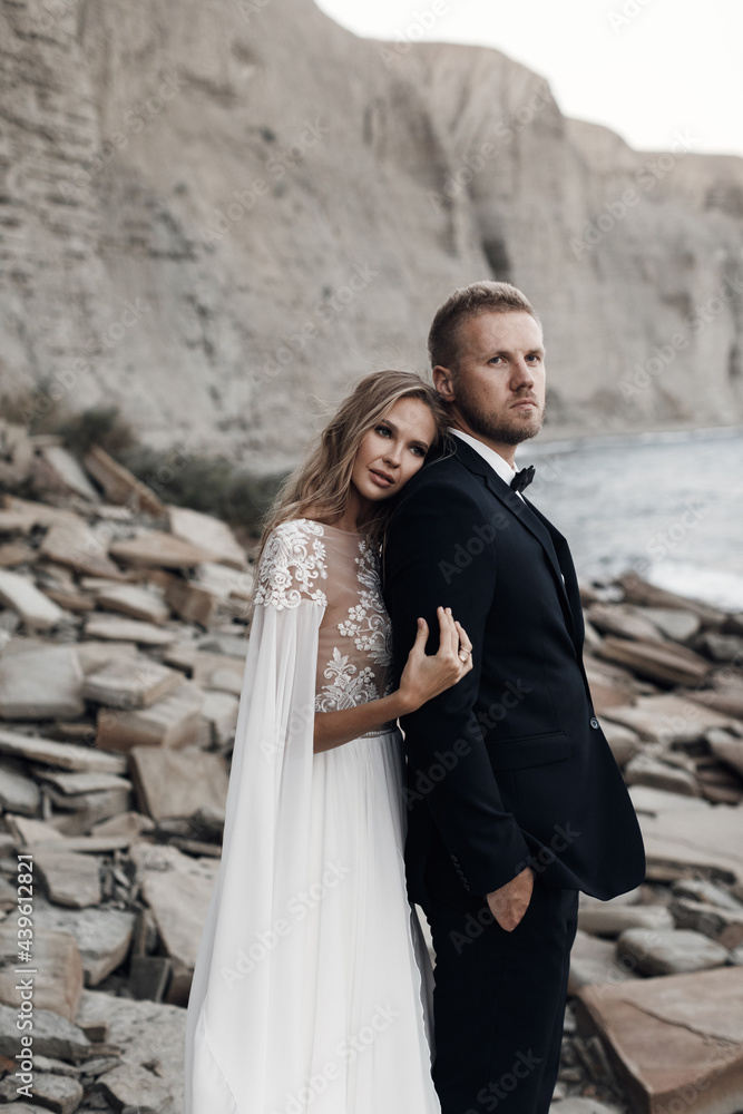 Fashion portrait of a bride and groom, Wedding couple Fashion portrait of a bride and groom, Wedding couple