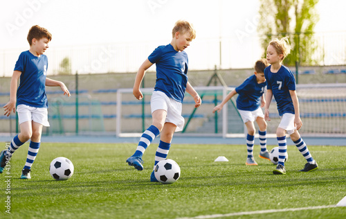 Boys in Blue Soccer Jersey Uniforms. Kids on Football Training