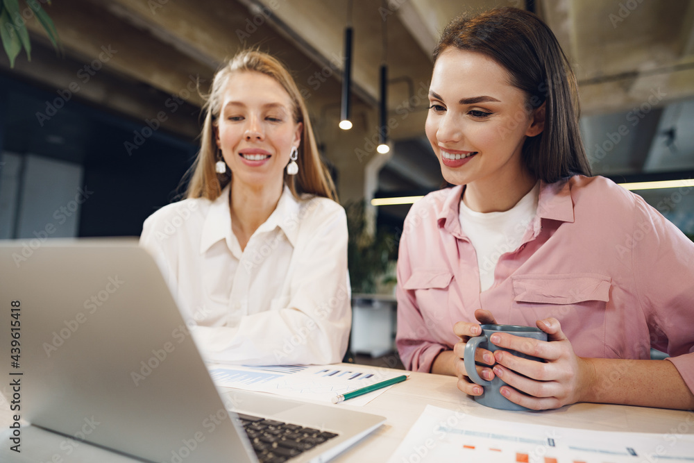Two women entrepreneurs working together in office Two women entrepreneurs working together in office