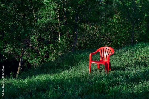 red chair on grass