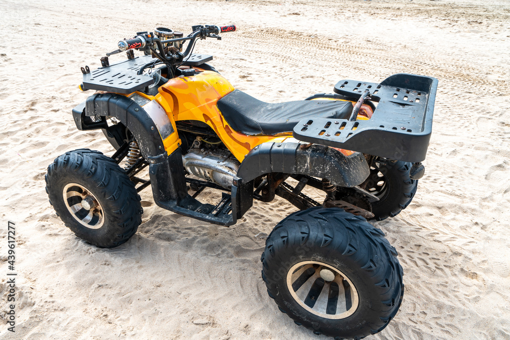 There is a beach motorcycle parked on the beach There is a beach motorcycle parked on the beach