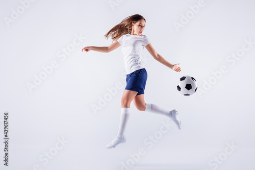 Full length body size view of nice attractive lovely slim sportive qualified cheerful straight-haired girl jumping running playing throwing ball isolated on light white gray pastel color background