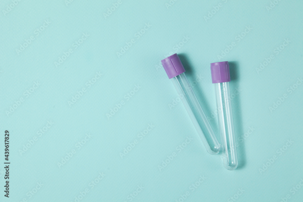Purple empty vacuum blood collection tube test with EDTA as anticoagulant. Purple empty vacuum blood collection tube test with EDTA as anticoagulant.