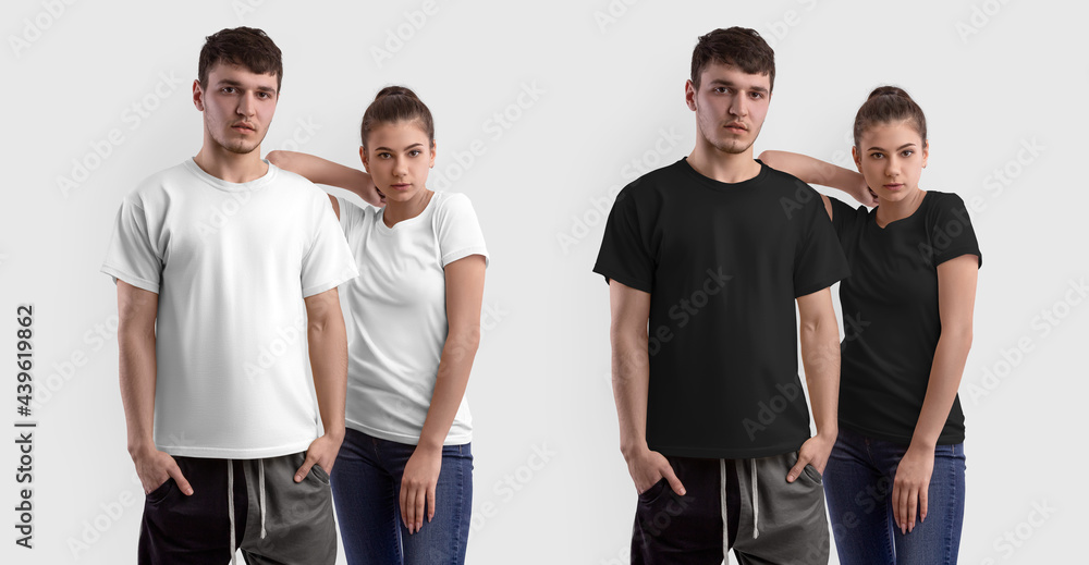 Obraz premium Stylish white, black T-shirt template on a guy and a girl posing, isolated on the background.