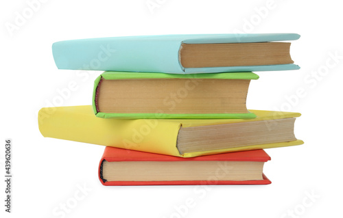 Many colorful hardcover books on white background