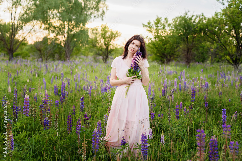 beautiful happy adult woman smiling and dancing in field. beautiful happy adult woman smiling and dancing in field.