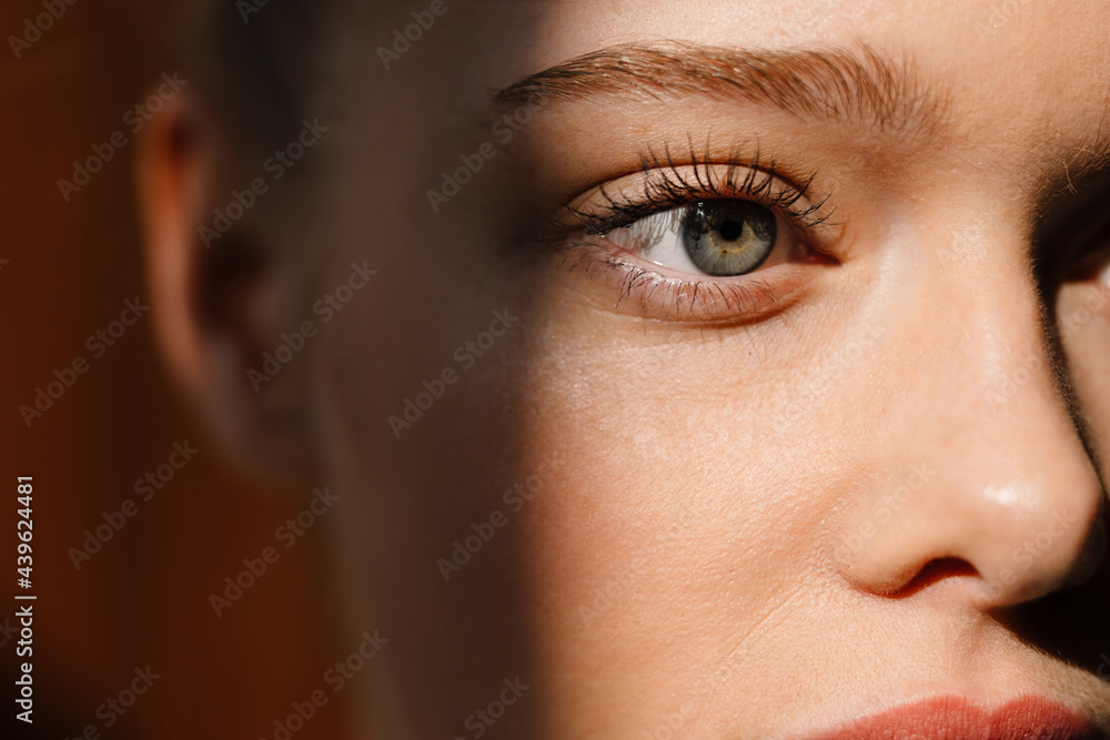 Fototapeta premium Young blonde white woman posing and looking aside indoors