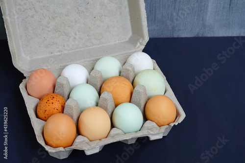 Colorful brown and grey free-range organic eggs photo