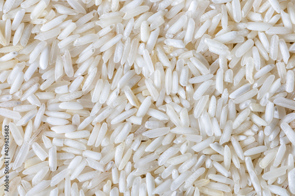 Jasmine rice,Top view of white rice seed texture background. Organic, natural long rice grain Jasmine rice,Top view of white rice seed texture background. Organic, natural long rice grain