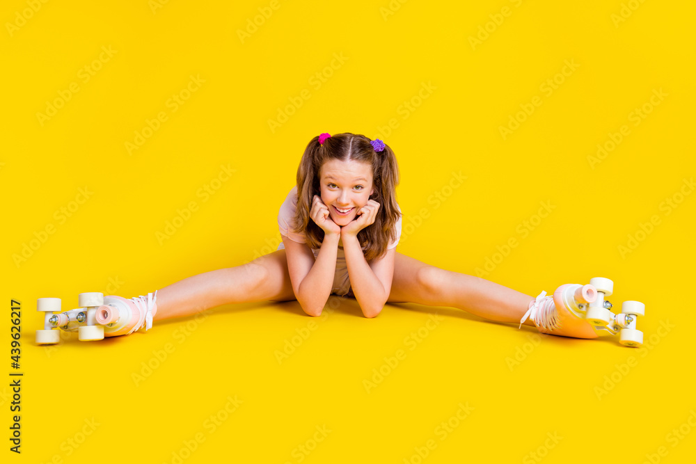 Ταπετσαρία Full length body size photo schoolgirl wearing rollers doing stretching exercise