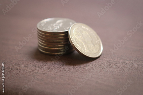 Coins stack on a dark background.