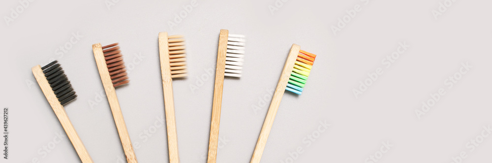 Set of ecology toothbrush on grey background. Different color. Diversity concept. Sustainable mouth product. Zero waste lifestyle. Organic accessory group. Dental health at home. Biodegradable recycle