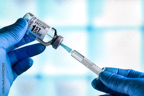 Photography Doctor preparing a dose for a patient of the first vaccine for Covid-19