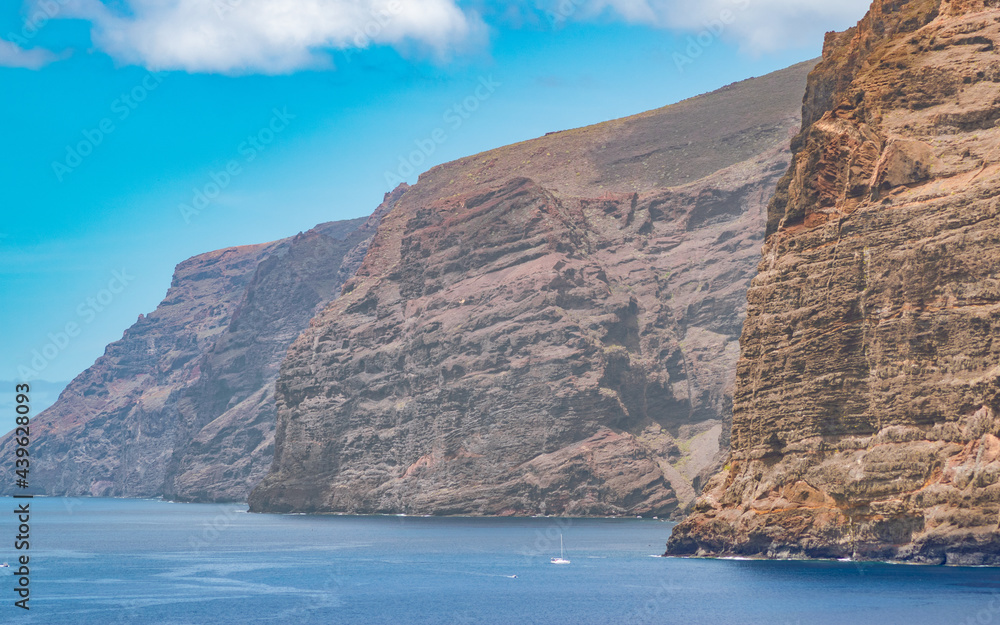 Boat under Los Gigantes cliffs in west Tenerife