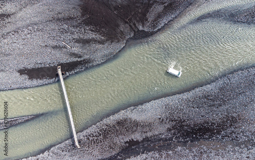 Car crossing glacial river in Icelandic highlands photo