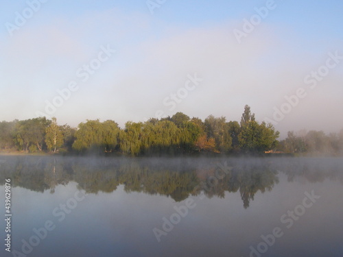 River in a fog with a forest landscape