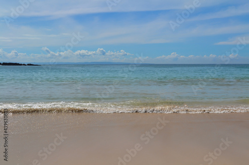 summer sea waves on the beach with blue sky