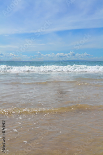 summer sea waves on the beach with blue sky