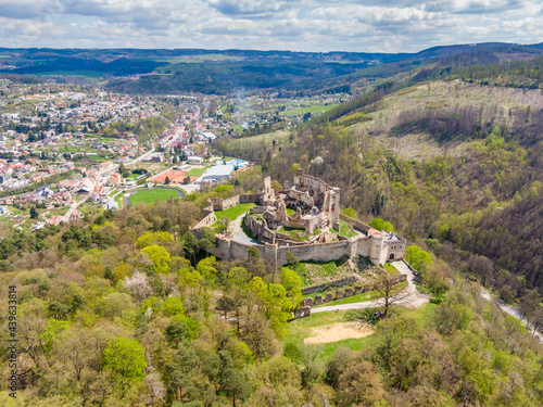 Aerial drone panorama view of medieval castle Boskovice. Ruin of ancient stronghold placed at hill in South Moravia region, Czech Republic. Summer day with blue sky. photo