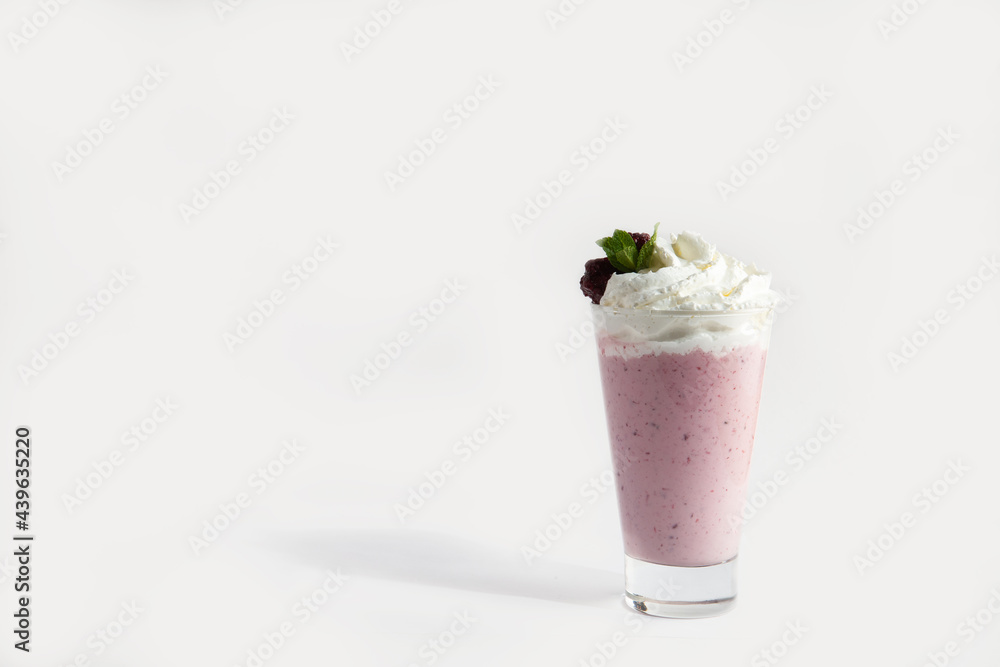 milkshakes in a glass with whipped cream and mint. Smoothie. on white background milkshakes in a glass with whipped cream and mint. Smoothie. on white background