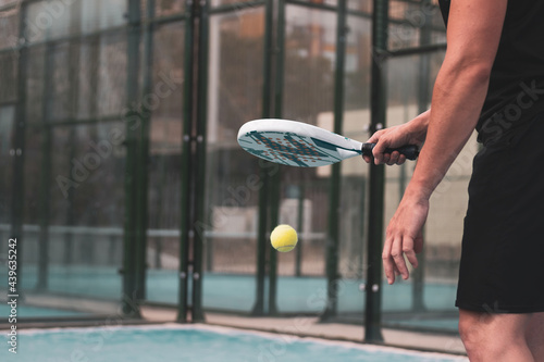 padel player playing a match in the open photo