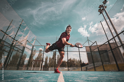 Fotografie padel player playing a match in the open